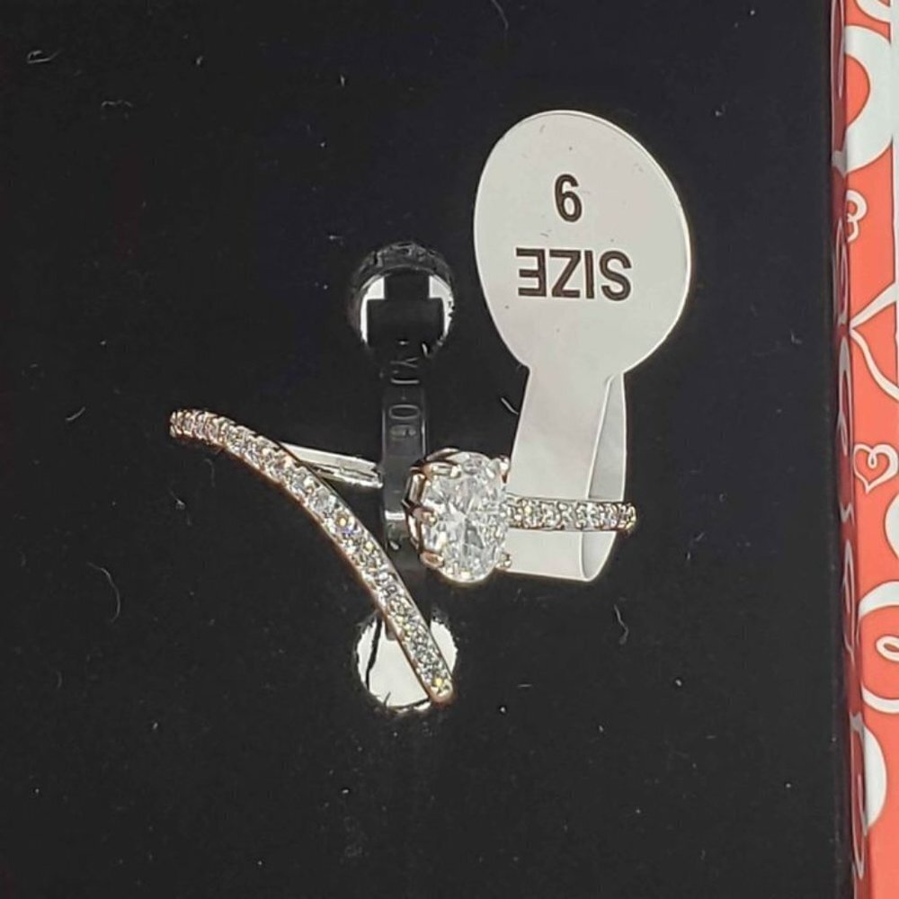 18k White Gold Plated Ring With Cubic Zirconia Stones And One Gemstone